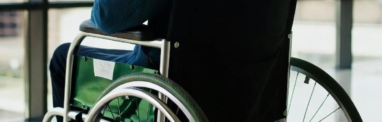 man in wheelchair in an airport