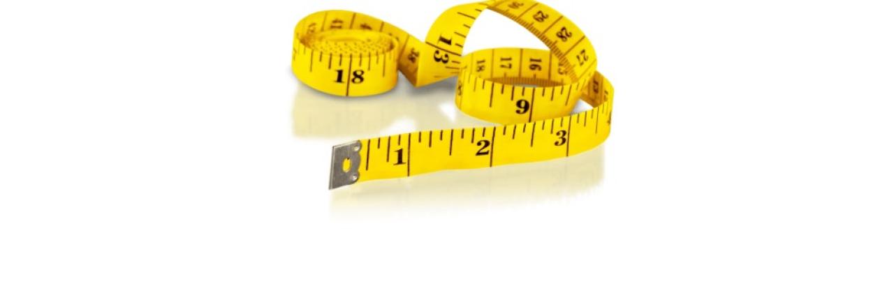 a color photograph of a yellow tape measure