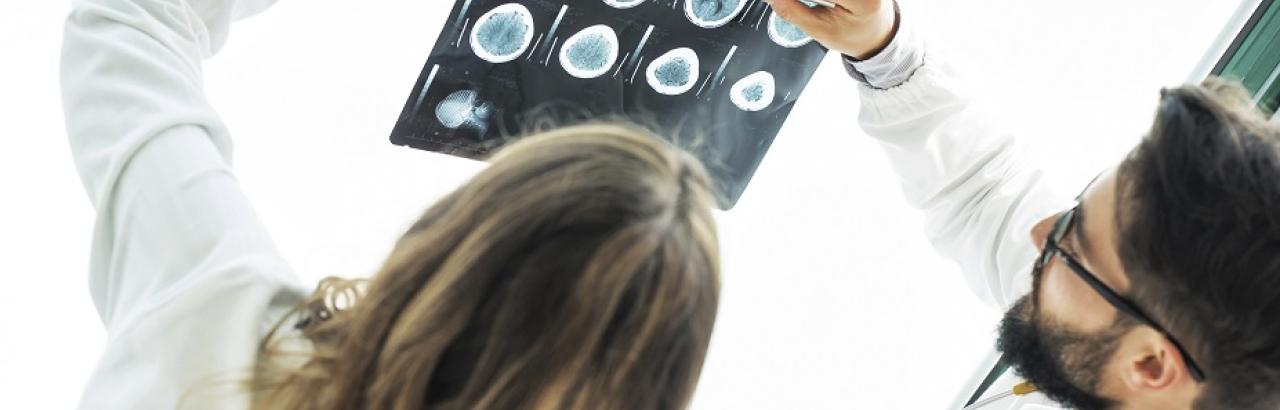 doctor and researcher look at MRI