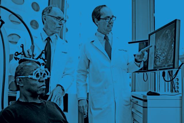 doctor, researcher, and participant looking at brain scan