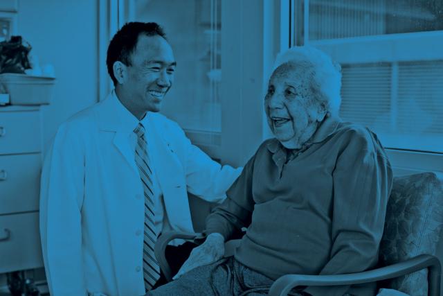 physician smiling with stroke patient
