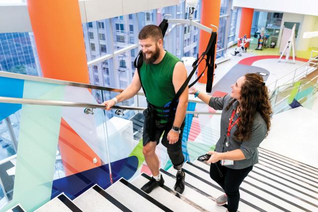 Physical Therapist with Patient in Legs + Walking Lab