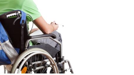 guy with green shirt, backpack in wheelchair
