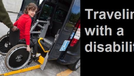 woman being pushed onto van ramp lift