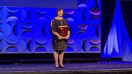 Leora recieving award