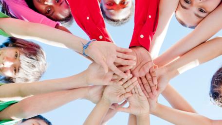 Kids hands in a circle