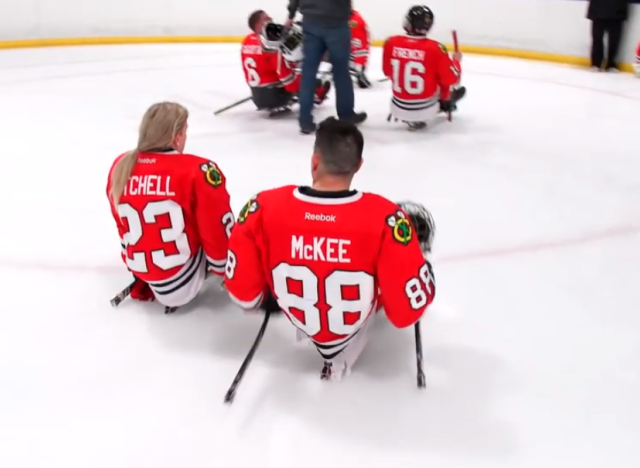 kevin and Erica on the ice after Blackhawks sled hockey game