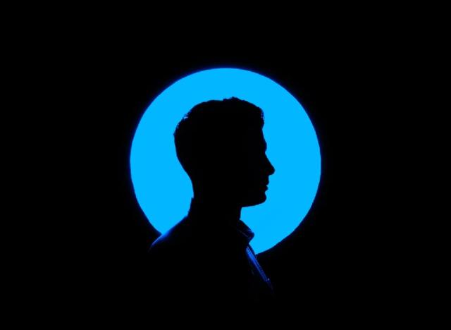 black background with cameo portrait with blue circle