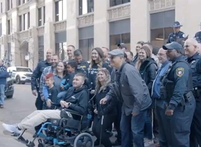 Officer Tyler Bailey’s poses for a photo with his well-wishers