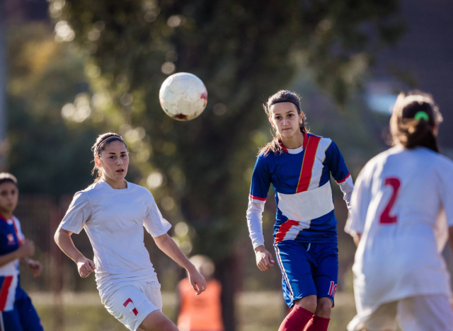 Women playing soccer