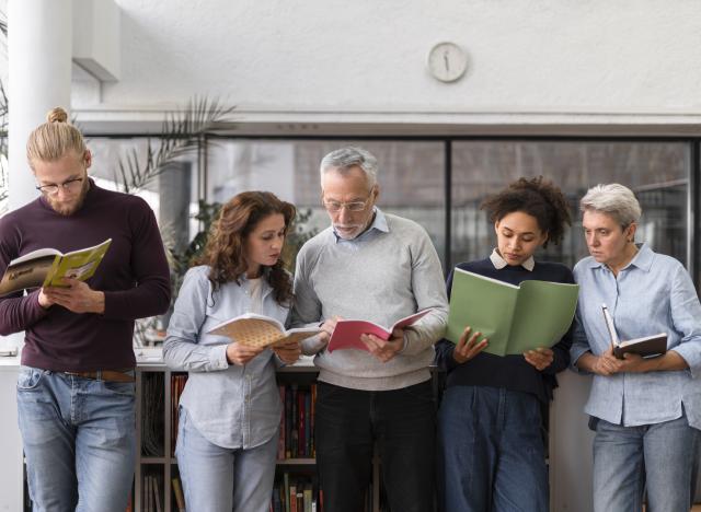 Adult literacy group reading books