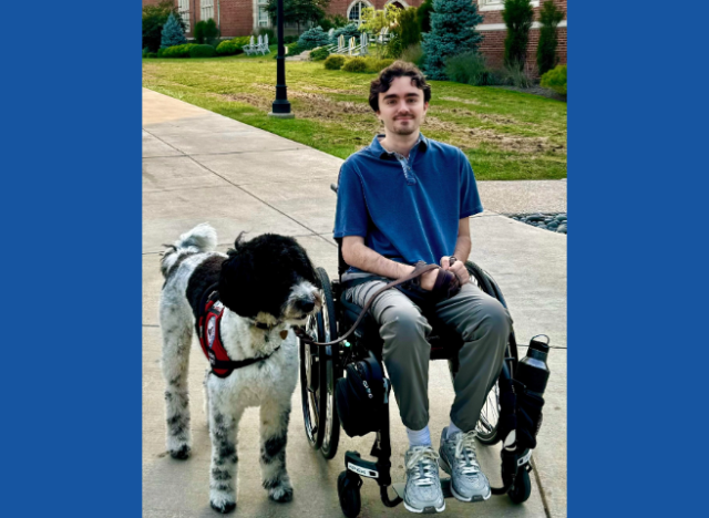 Steph with his service dog, Noel