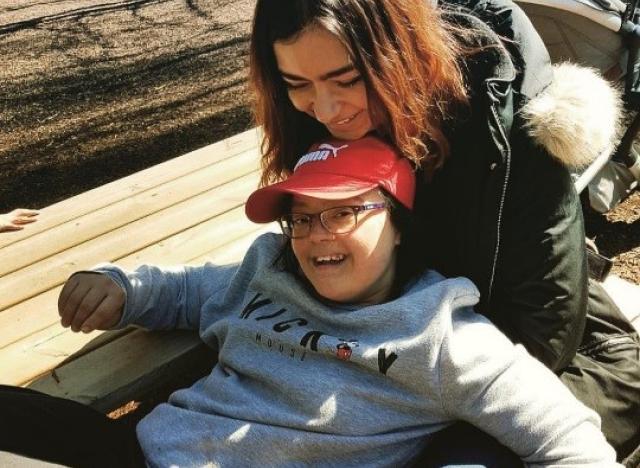 a child and a woman smiling