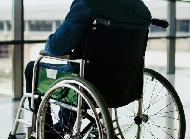 man in wheelchair in an airport