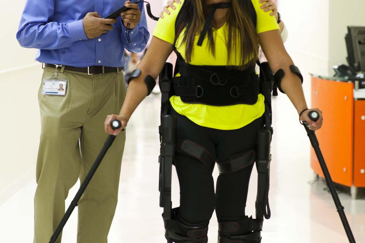 Patient uses ExoSkeleton to walk