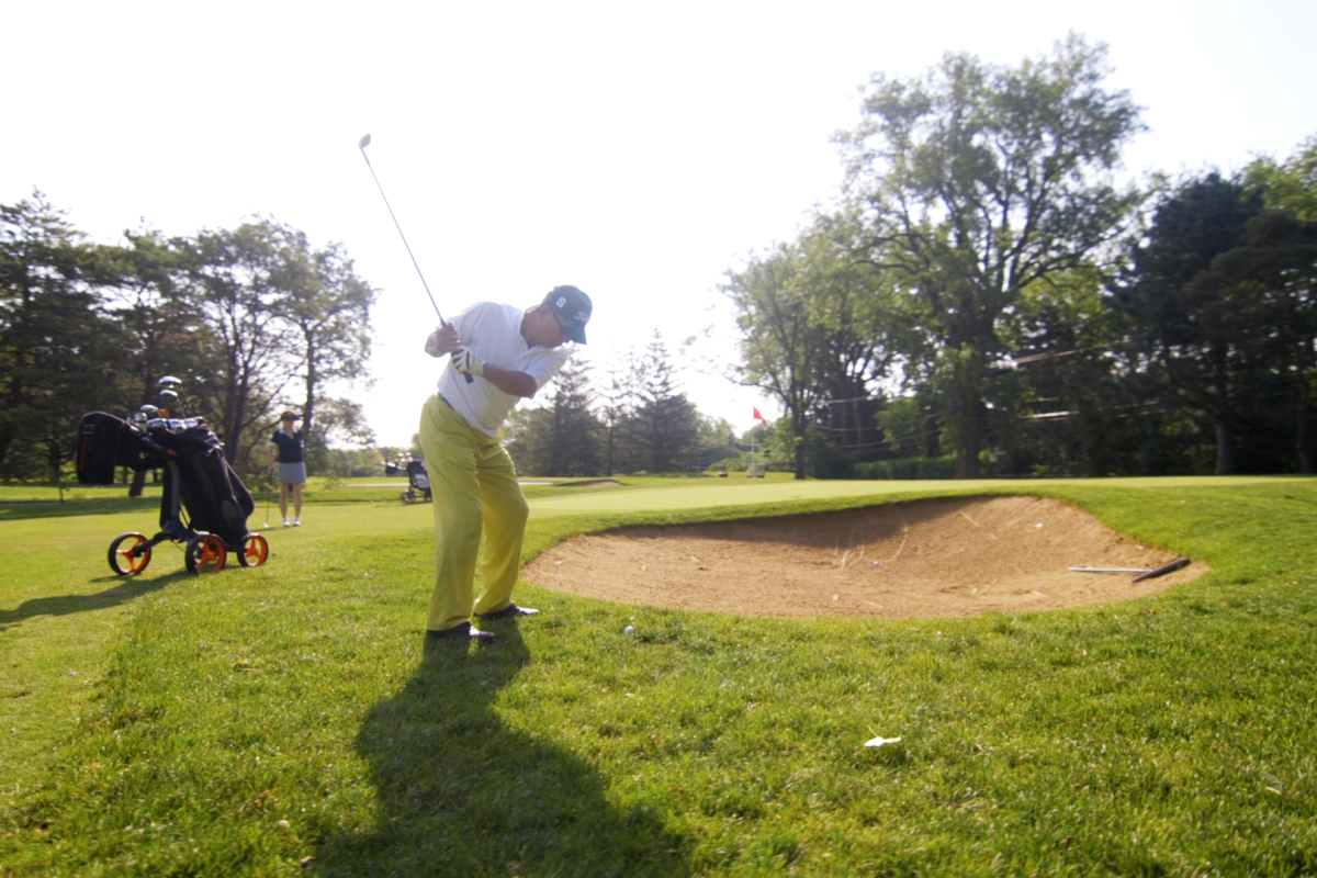 man golfing
