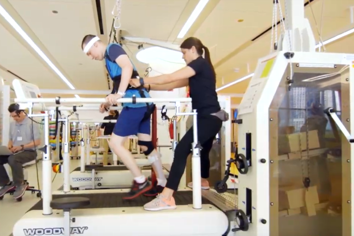 Ryan walking on a treadmill after his stroke