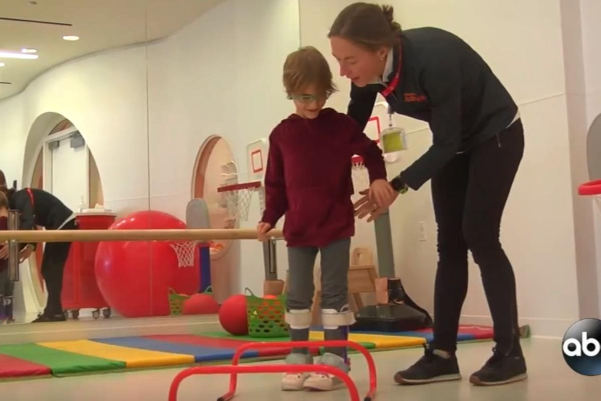 child with CP interacts with therapist at Shirley Ryan AbilityLab