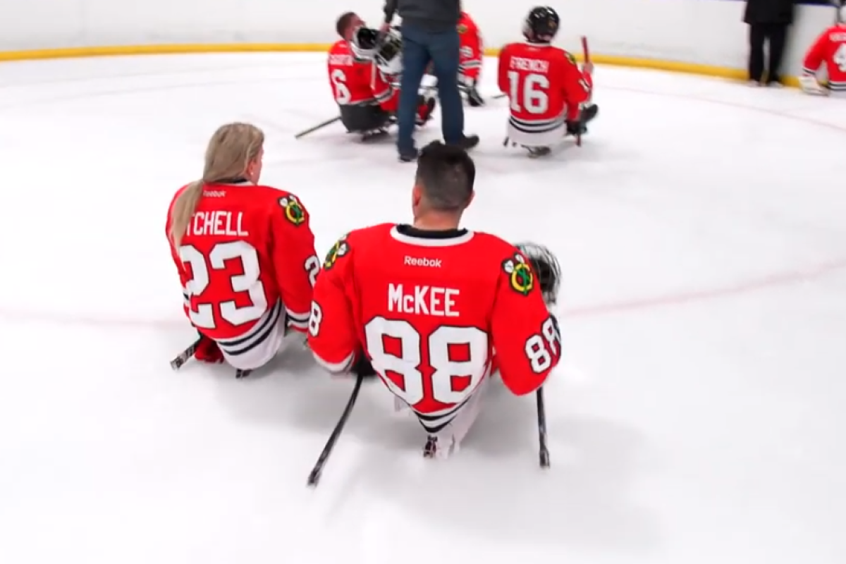 kevin and Erica on the ice after Blackhawks sled hockey game