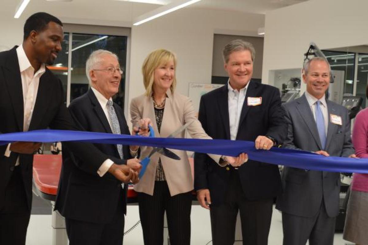 Joanne C. Smith, MD, president and CEO of Shirley Ryan AbilityLab, Homewood Mayor Rich Hofeld and Illinois State Senator Napoleon B. Harris, and others cut the ribbon at the new Homewood DayRehab Center