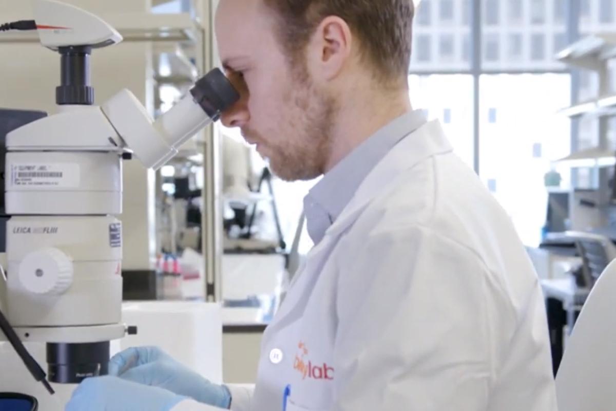 Man in lab coat in biologics lab