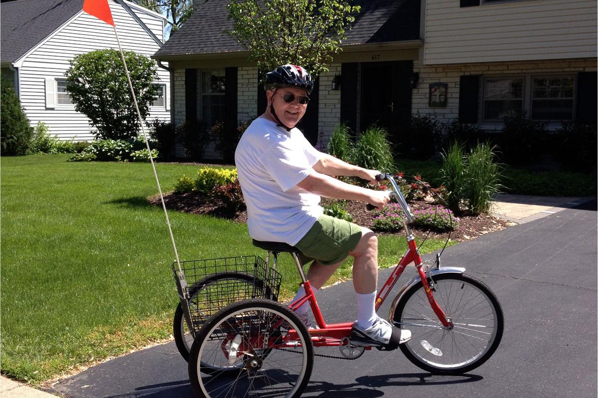 Walter Mason on a bike as he rejoins his community after stroke