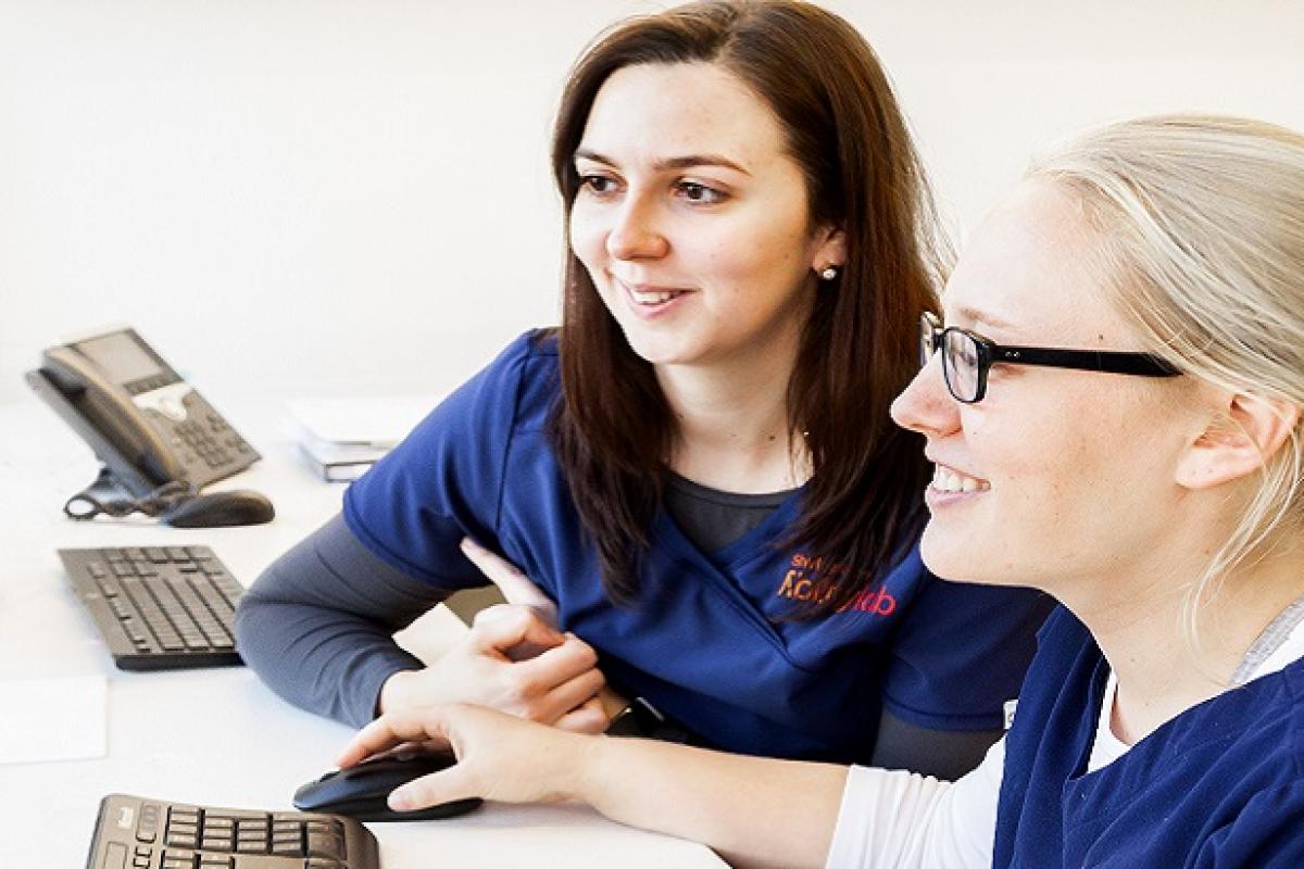 Two Shirley Ryan AbilityLab employees at a computer