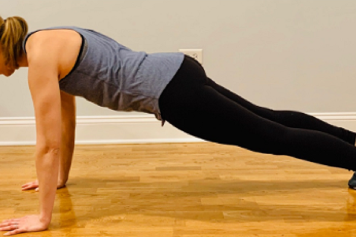 Therapist demonstrating correct push-up form