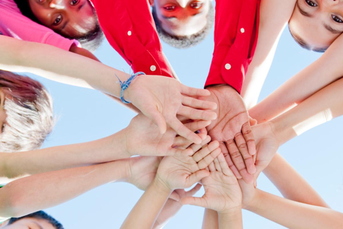 Kids hands in a circle