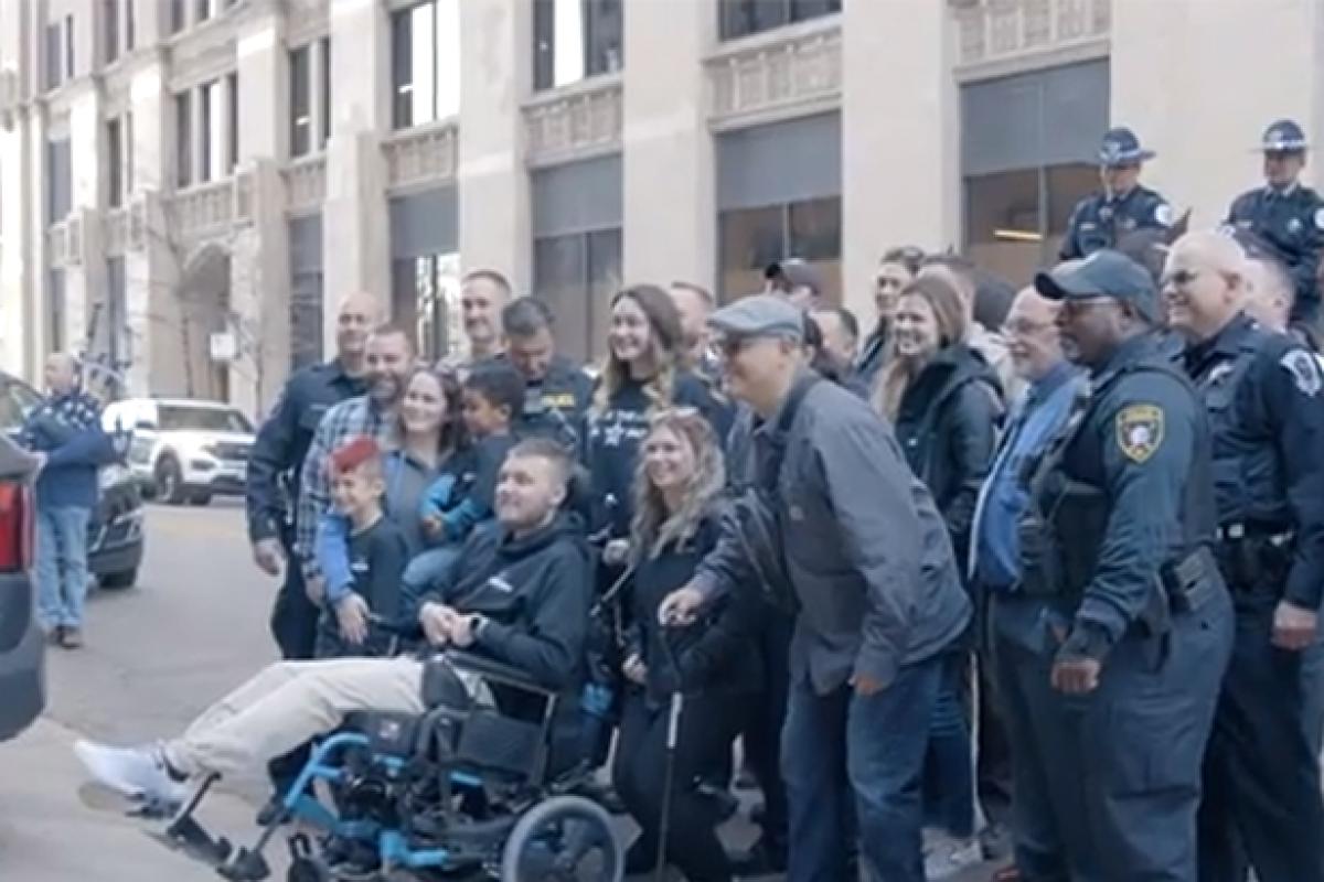 Officer Tyler Bailey’s poses for a photo with his well-wishers