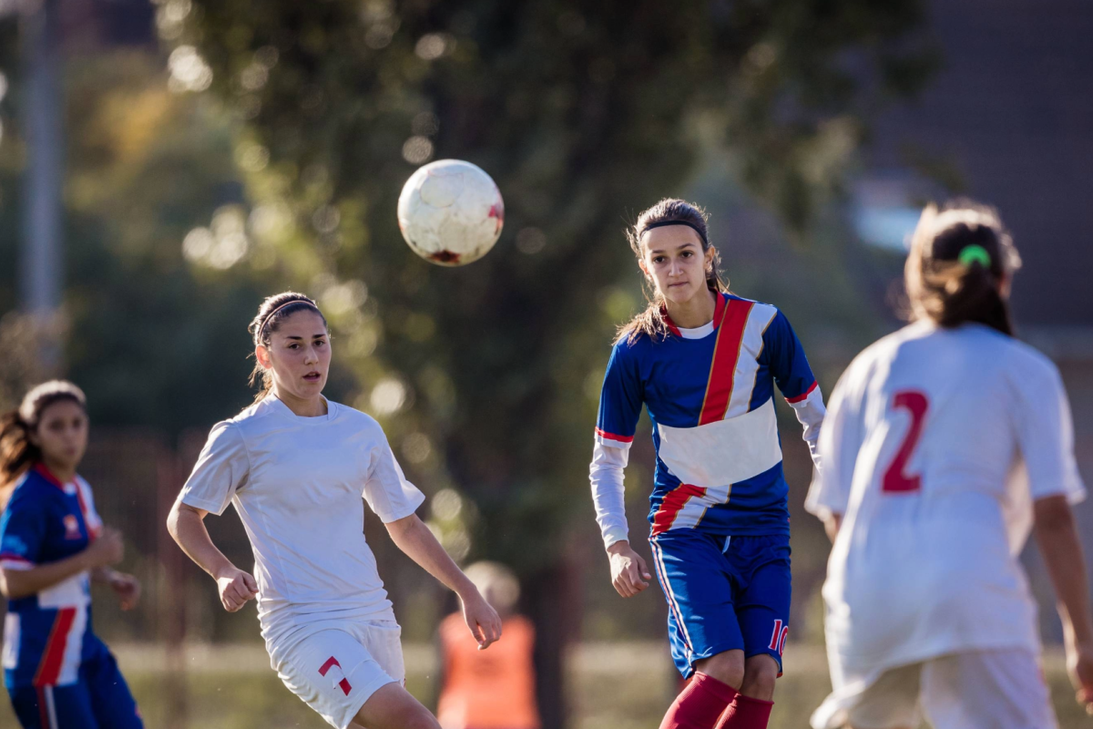 Women playing soccer