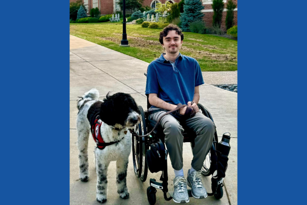 Steph with his service dog, Noel