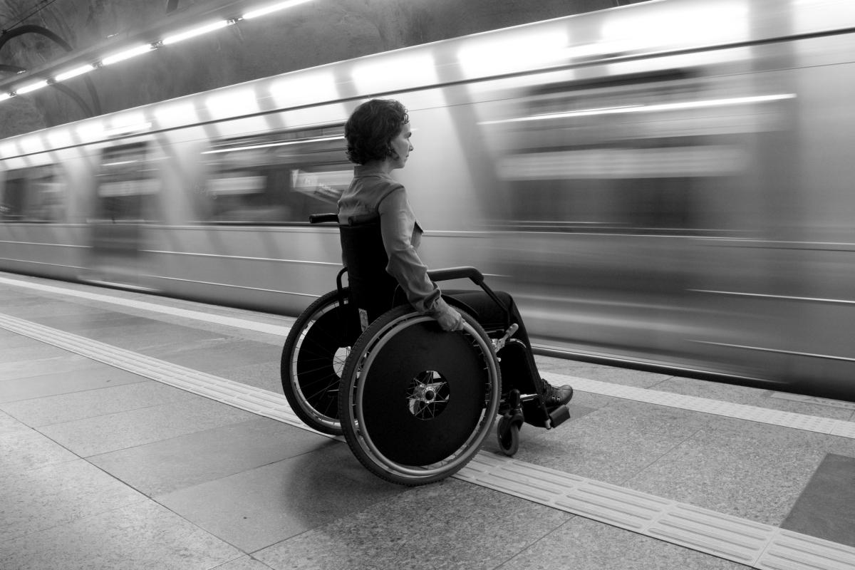 Person in wheelchair on the subway