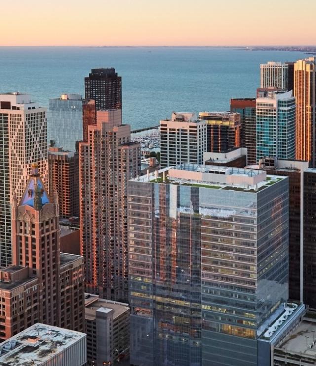 Shirley Ryan AbilityLab visible within the Chicago skyline during sunset.