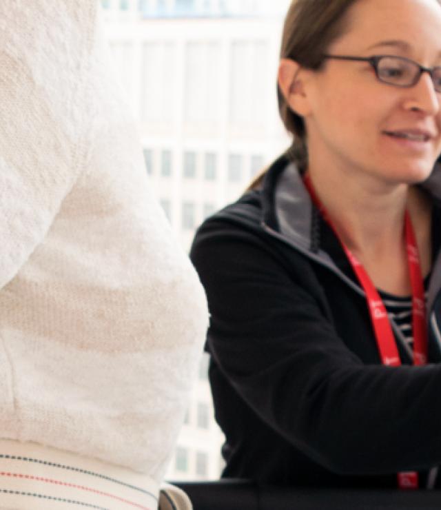Miriam Rafferty assists patient on Muscle and Strength Lab