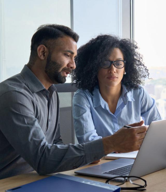 two people looking at a computer screen