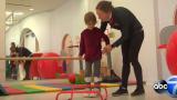 child with CP interacts with therapist at Shirley Ryan AbilityLab