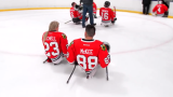 kevin and Erica on the ice after Blackhawks sled hockey game