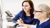 Two Shirley Ryan AbilityLab employees at a computer