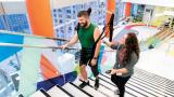 Physical Therapist with Patient in Legs + Walking Lab