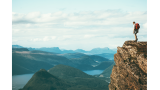 Person standing at edge of cliff