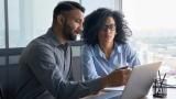 two people looking at a computer screen