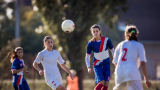 Women playing soccer