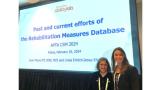 Linda Ehrlich-Jones and Jenni Moore in front of their slide presentation on the RMD at the APTA CSM meeting