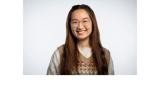 a photo of My Le, a Vietnamese young woman with long brown hair and glasses