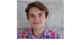 photo of Ross Kaine, a young white man with brown short hair wearing a blue and pink plaid shirt
