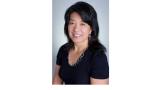Color photo of Shu Cole, a middle-aged Asian woman with black hair and a black top