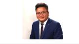 color photo of Alex Wong, a young Chinese man with black hair, glasses wearing a jacket and tie