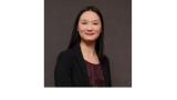 color photo of Amy Zhou, a young woman of Chinese descent with long black hair wearing a black top