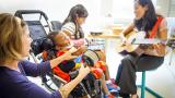 Music therapist works with a pediatric patient